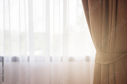 Sunlight through the white curtain and windows