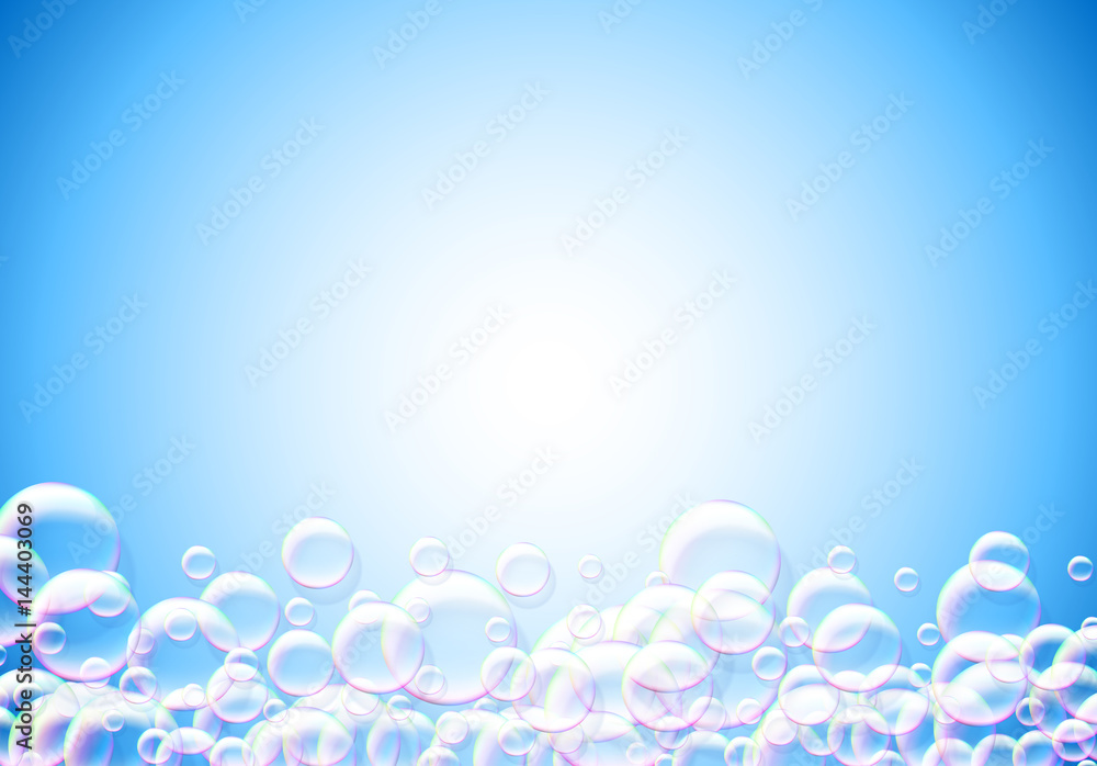 Soap bubbles abstract blue background with rainbow colored airy foam Soap bubbles abstract blue background with rainbow colored airy foam