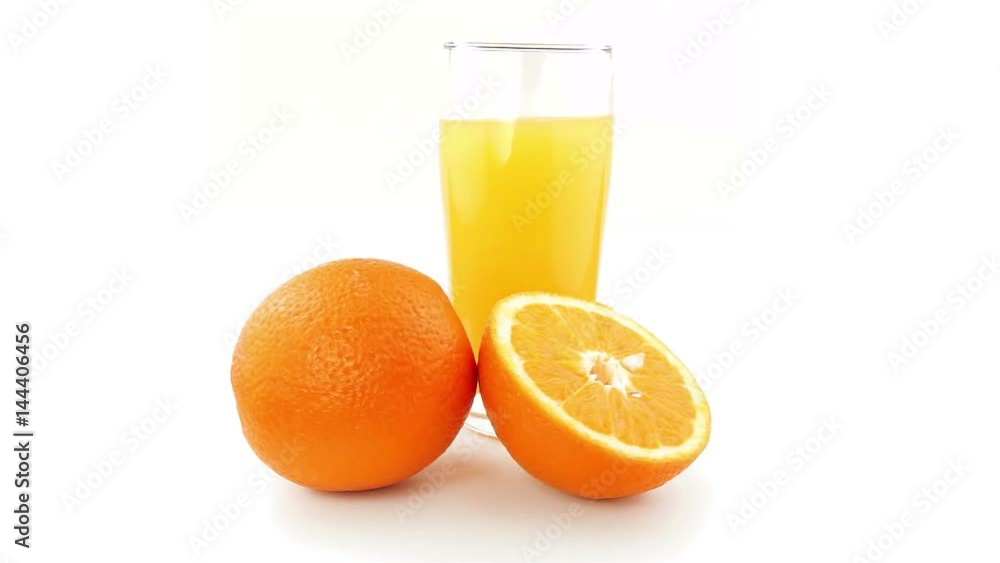Oranges and orange juice Rotating on a white background Oranges and orange juice Rotating on a white background
