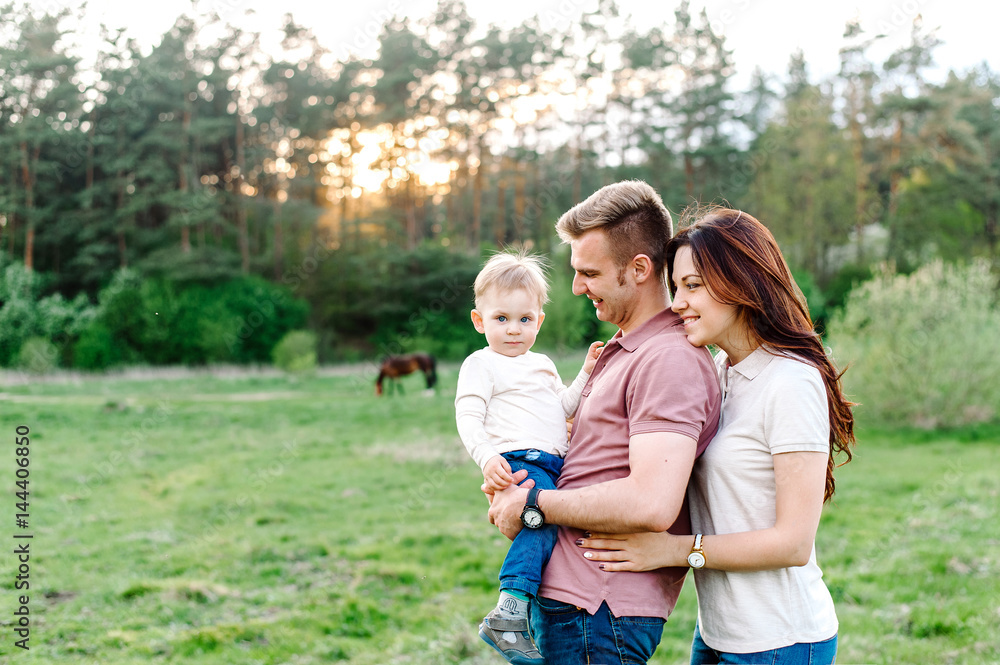 Obraz premium Happy family walking outdoor