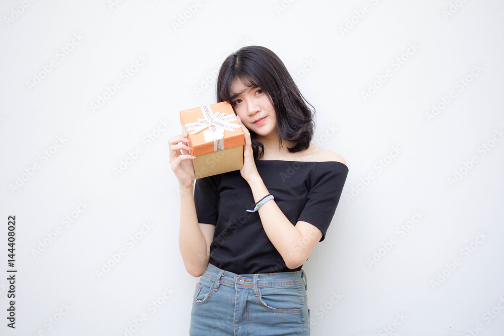 Portrait of thai vietnam teen beautiful girl hold gift box in hands Portrait of thai vietnam teen beautiful girl hold gift box in hands