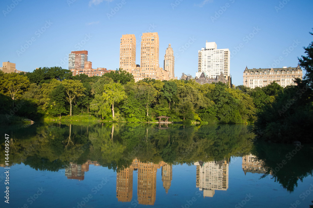Reflection of buildings in the lake at Central Park Reflection of buildings in the lake at Central Park
