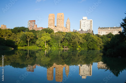 Reflection of buildings in the lake at Central Park © Spinel