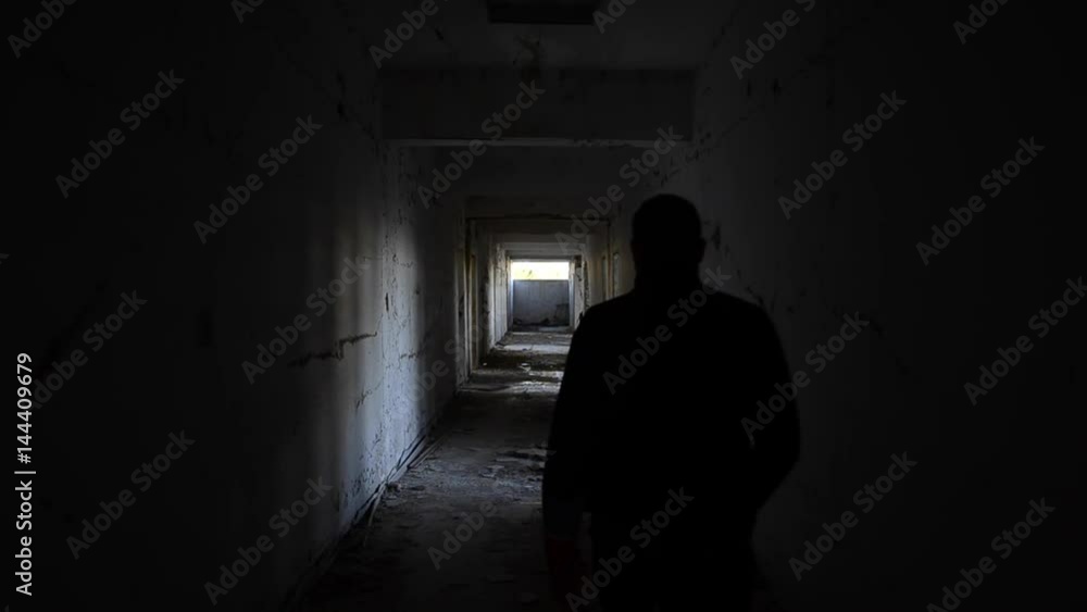 Abandoned creepy hallway, men walk Abandoned creepy hallway, men walk