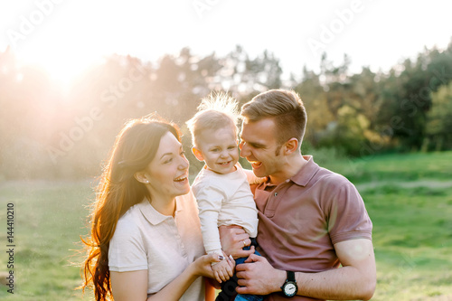 Happy family walking outdoor photo