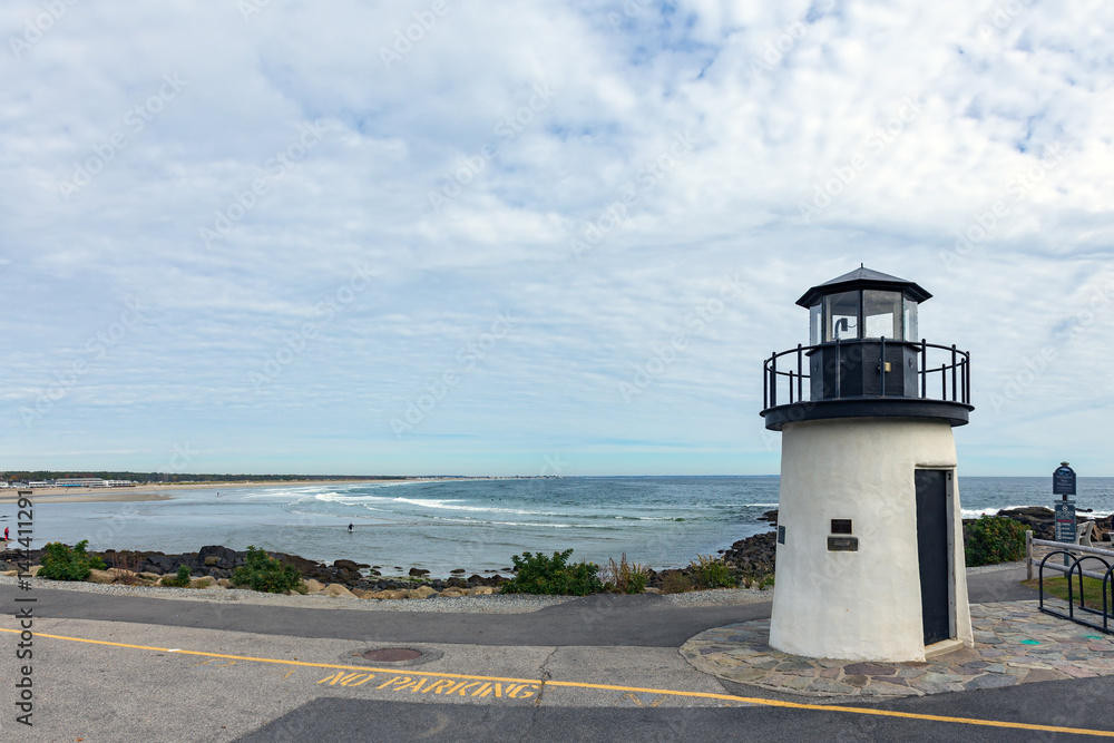Small lighthouse at the coast of Atlantic in Ogunquit,  Maine, USA