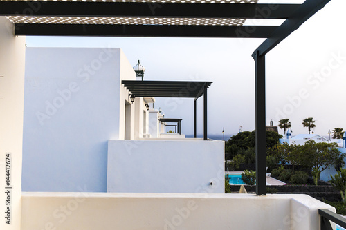 White terraces perspective in a row on a summer hotel resort photo