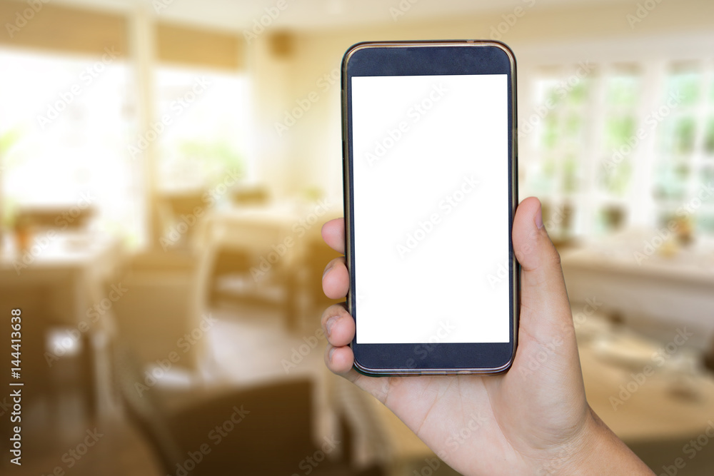 Man hand holding mobile smart phone , tablet,cellphone over Blur or Defocus image of Coffee Shop or Cafeteria,Customer at restaurant blur background with bokeh ,vintage color,food online call shopping Man hand holding mobile smart phone , tablet,cellphone over Blur or Defocus image of Coffee Shop or Cafeteria,Customer at restaurant blur background with bokeh ,vintage color,food online call shopping