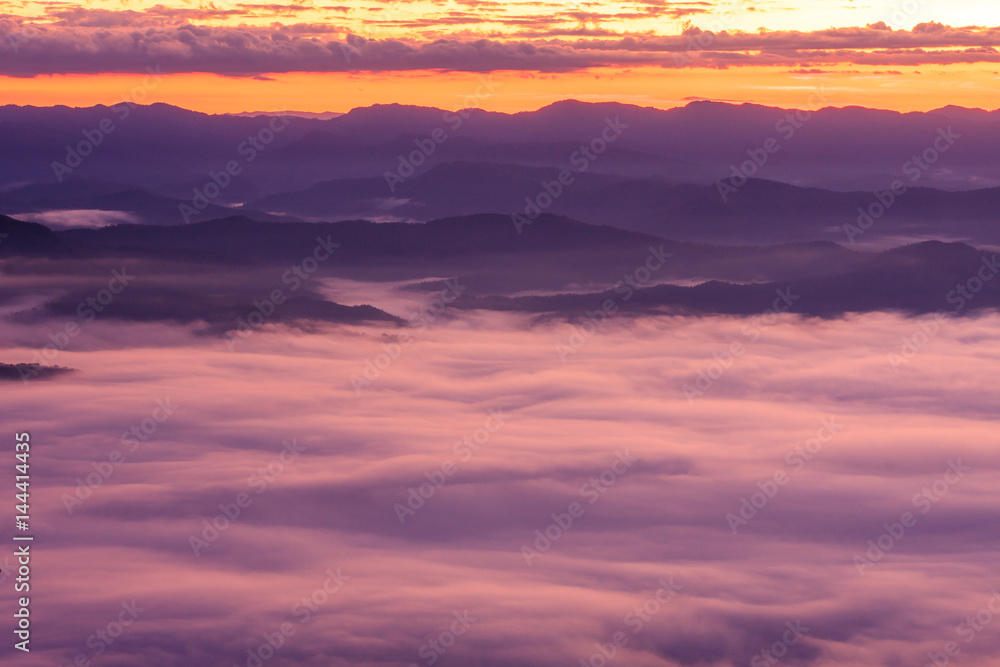 Morning scene of fog on high hill landscape along the valley and sunrise atmosphere from mountain peak.