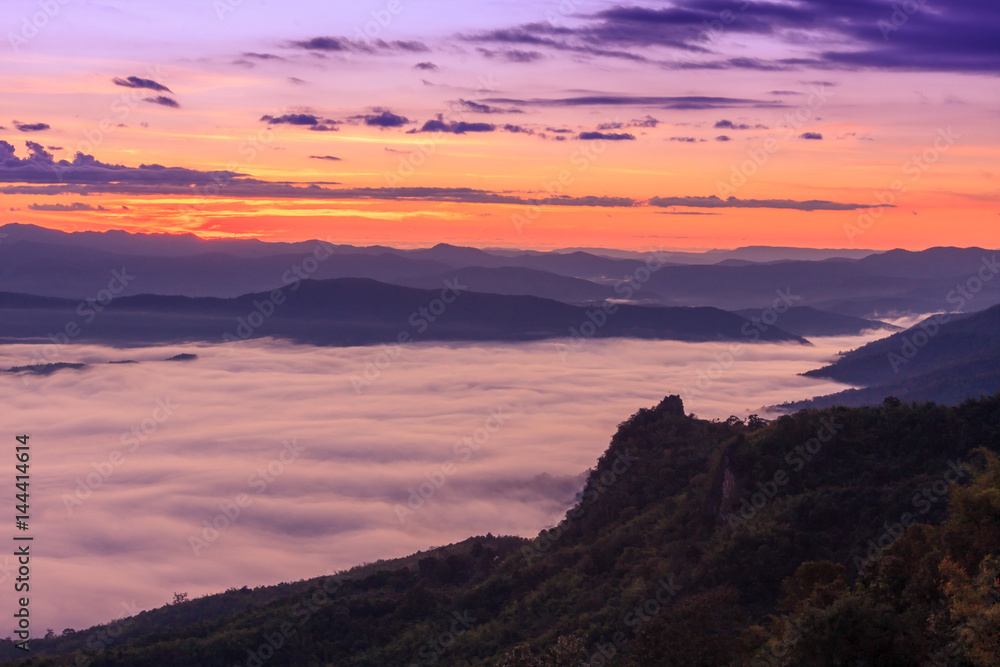 Morning scene of fog on high hill landscape along the valley and sunrise atmosphere from mountain peak.