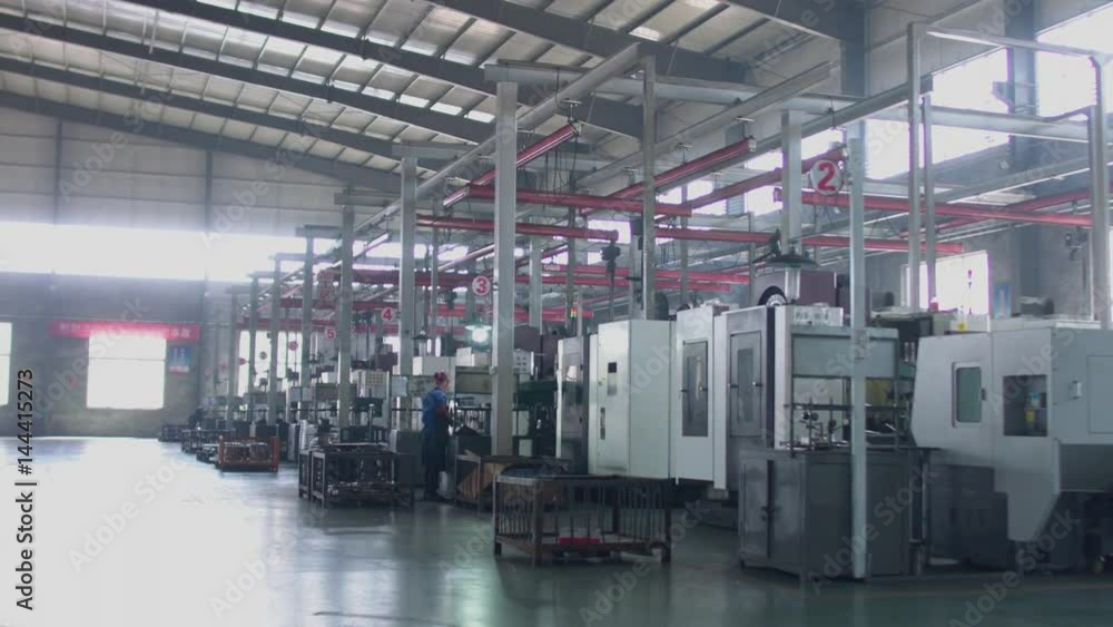WIDE TILT DOWN shot of a modern clean factory interior. HD WIDE TILT DOWN shot of a modern clean factory interior. HD