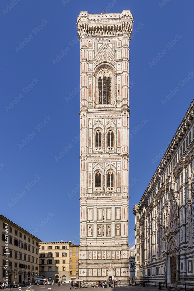 Magnificent vertical view of Giotto's Campanile of the Duomo in Florence, Italy, on a sunny day