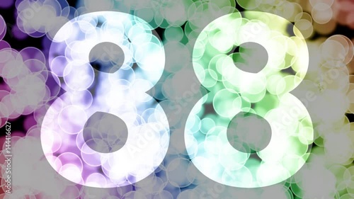 Eighty eight to eighty nine years birthday fade in/out animation with color gradient moving bokeh background. Animation: 90 frames still with number, 180 fade out, 30 clear, 180 fade in, 300 still. photo