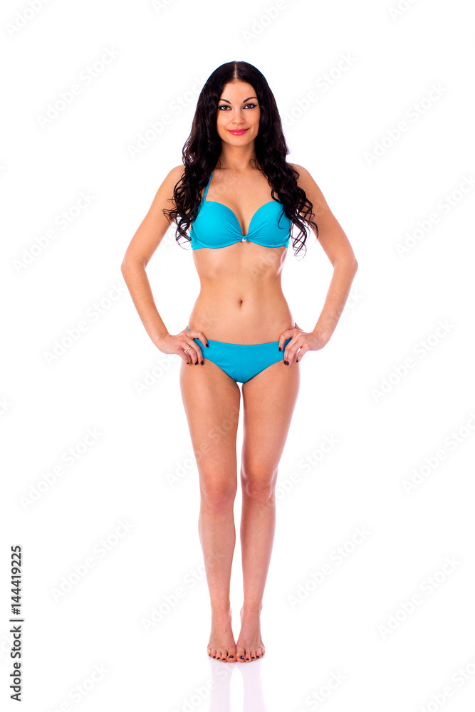 Full length portrait of young girl wearing blue bikini Full length portrait of young girl wearing blue bikini