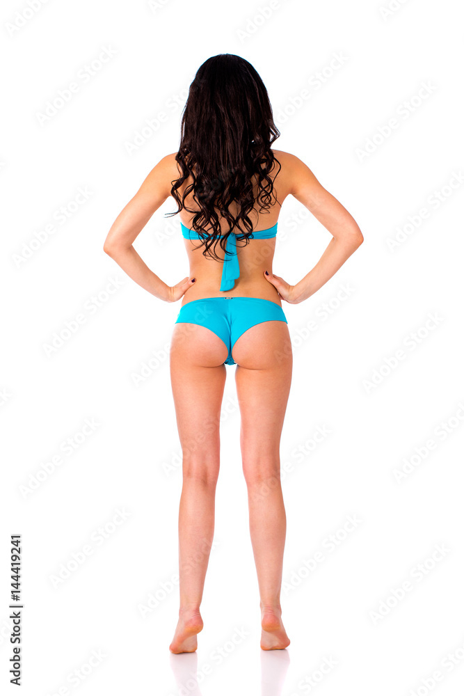 Full length portrait of young girl wearing blue bikini Full length portrait of young girl wearing blue bikini