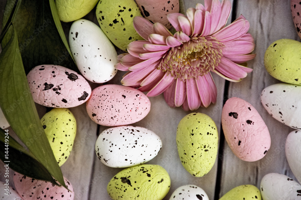 colour easter eggs with pink flower