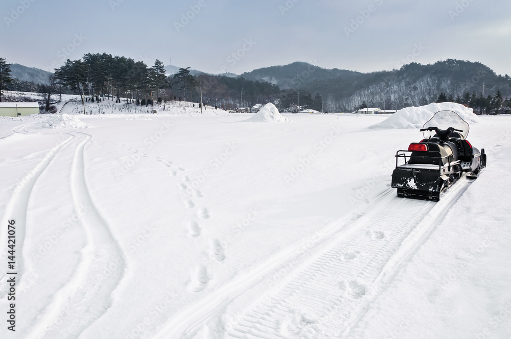 Snowmobile parking in the mountains ski resort Snowmobile parking in the mountains ski resort