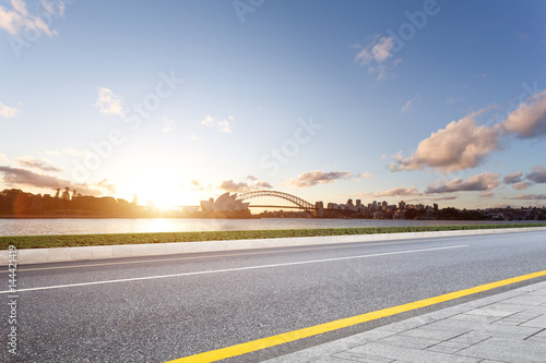 empty road with sydney opera house and bridge