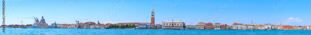 Panoramic cityscape beautiful ancient town. Venice, laguna view on Basilica di Santa Maria della Salute, Piazza San Marco with Campanile, Doge Palace, and Arsenale. Venice, Italy.