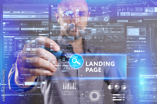 Business, Technology, Internet and network concept. Young businessman working on a virtual screen of the future and sees the inscription: Landing page