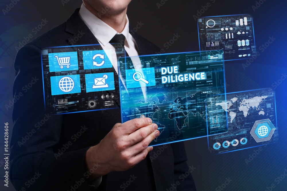 Business, Technology, Internet and network concept. Young businessman working on a virtual screen of the future and sees the inscription: Due diligence Business, Technology, Internet and network concept. Young businessman working on a virtual screen of the future and sees the inscription: Due diligence