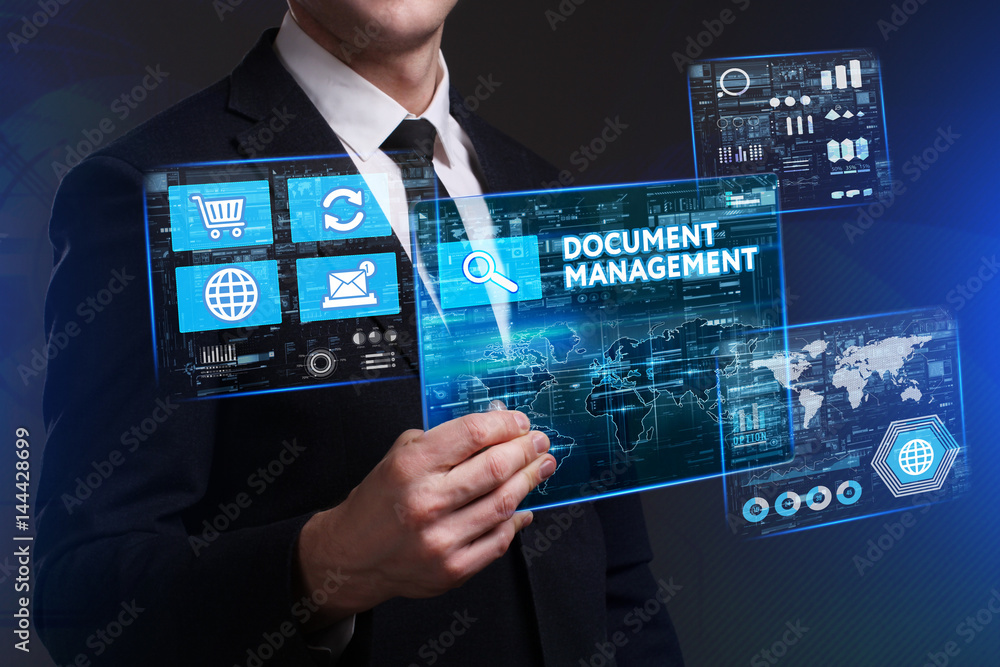 Business, Technology, Internet and network concept. Young businessman working on a virtual screen of the future and sees the inscription: Document management Business, Technology, Internet and network concept. Young businessman working on a virtual screen of the future and sees the inscription: Document management