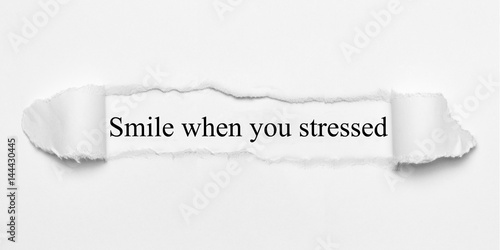 Smile when you stressed on white torn paper