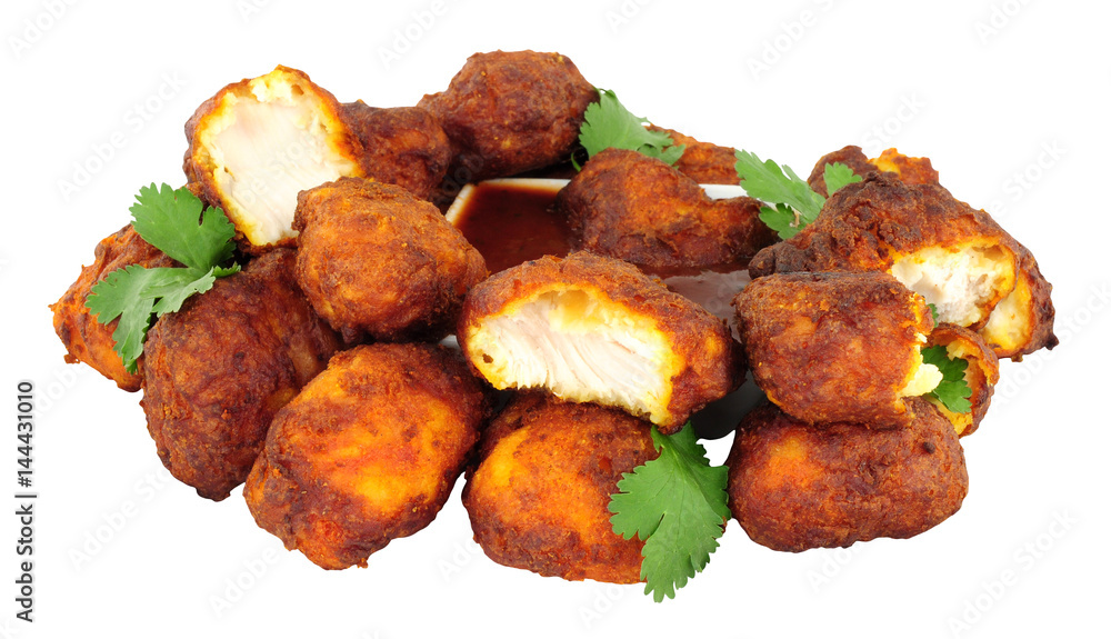 Group of fried chicken pakora with chilli sauce dip isolated on a white background Group of fried chicken pakora with chilli sauce dip isolated on a white background