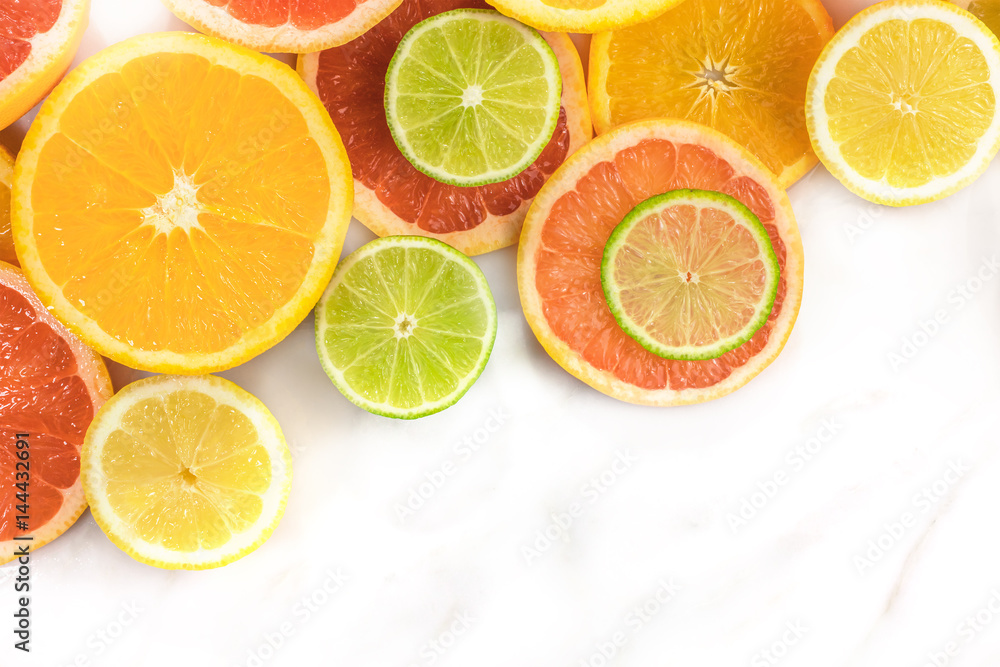 Grapefruit, lime, lemon, and orange slices with copyspace Grapefruit, lime, lemon, and orange slices with copyspace