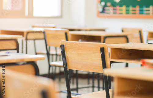 Chair in empty classroom, lecture armchairs in school, or college