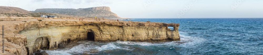 Panorama of sea caves and Mediterranean at sunset. Cape Greko, Cyprus. 
