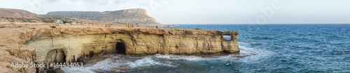 Panorama of sea caves and Mediterranean at sunset. Cape Greko, Cyprus. 