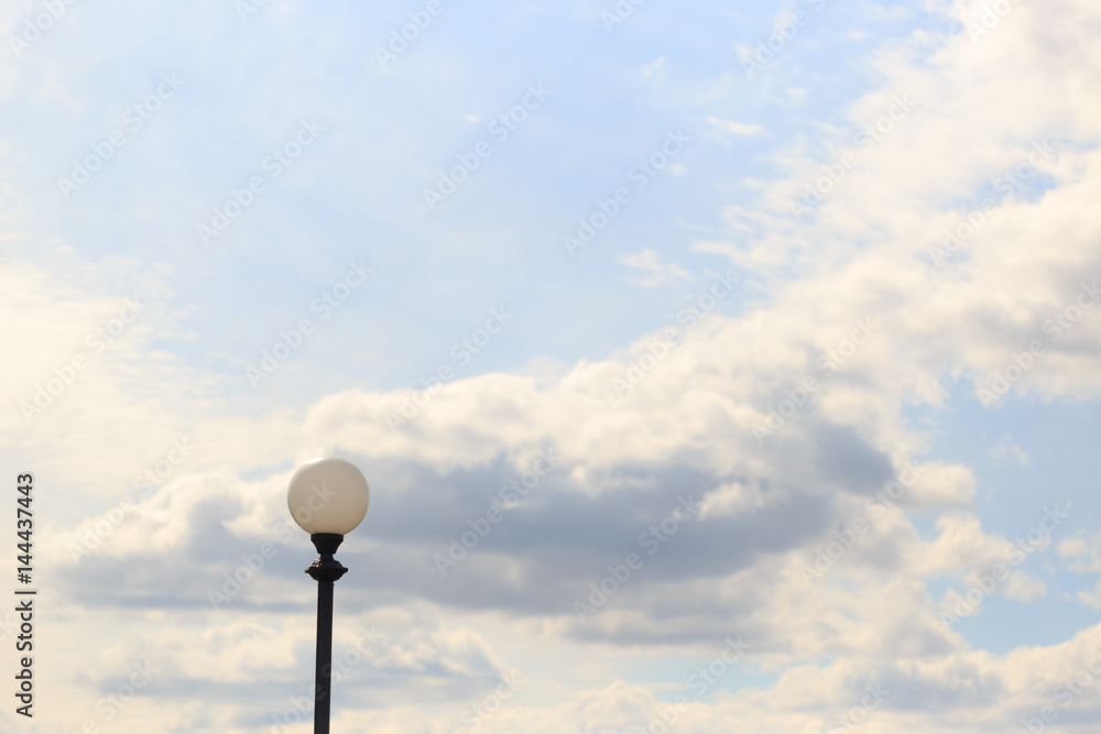 Lonely lamppost against the sky and clouds Lonely lamppost against the sky and clouds