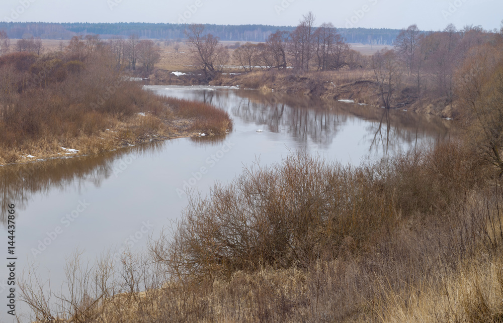 Panorama of Zhizdra River valley with spring ice drifting at early morning before dawn. Bulatovo, Kaluzhskaya region, Russia.
