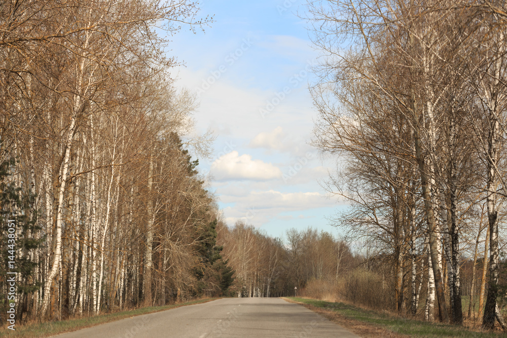 Auto road against the sky and clouds