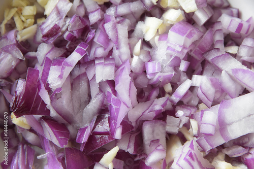 Onions cut into cubes as a food background