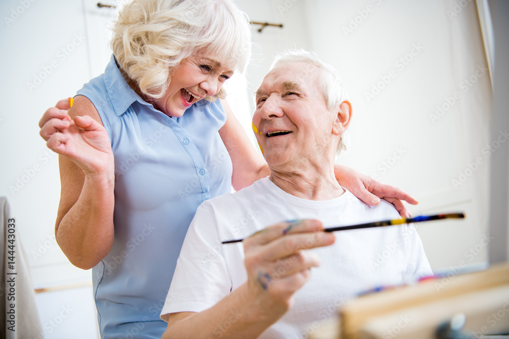 portrait of happy senior man and woman in art workshop portrait of happy senior man and woman in art workshop