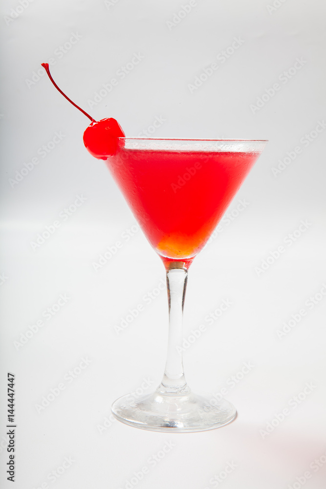 colourful coctail with cherry on the black background colourful coctail with cherry on the black background