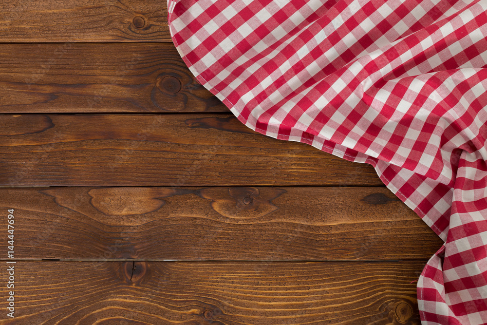 Background with empty wooden table with tablecloth Background with empty wooden table with tablecloth