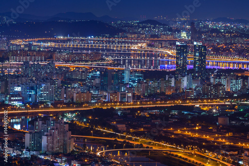 Seoul city and bridge and Han river at night,  South Korea. © panyaphotograph