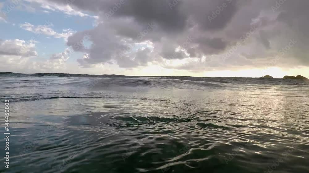 Swimming at dawn and diving under waves Swimming at dawn and diving under waves