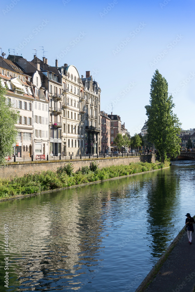STRASBOURG, FRANCE - August 23, 2016 : Street view of Traditional houses in Strasbourg, Alsace. is the official seat of the European Parliament, Located close to the border with Germany STRASBOURG, FRANCE - August 23, 2016 : Street view of Traditional houses in Strasbourg, Alsace. is the official seat of the European Parliament, Located close to the border with Germany