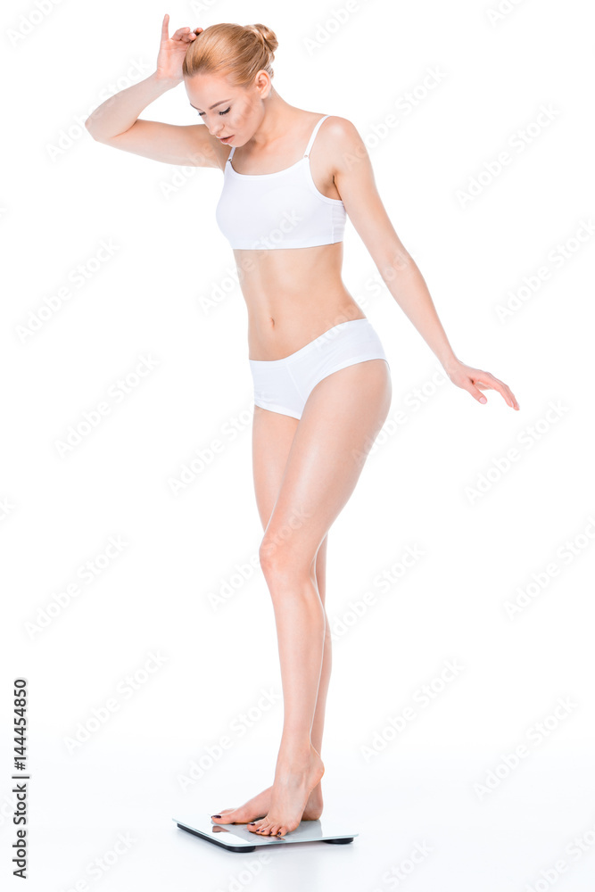 Fototapeta premium Woman on digital scales