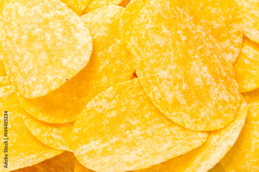 yellow potato chips isolated on white yellow potato chips isolated on white