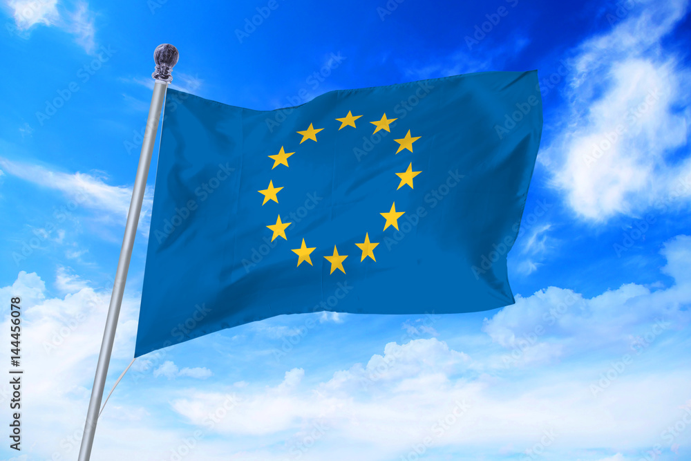 Flag of European Union (EU) developing against a clear blue sky
