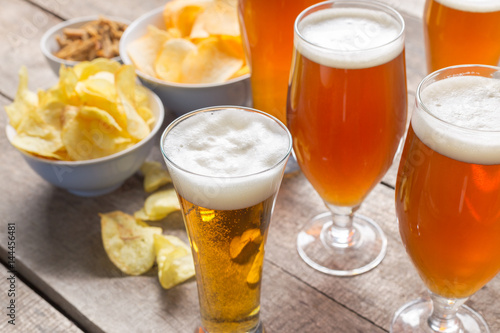 glass beer on wood background