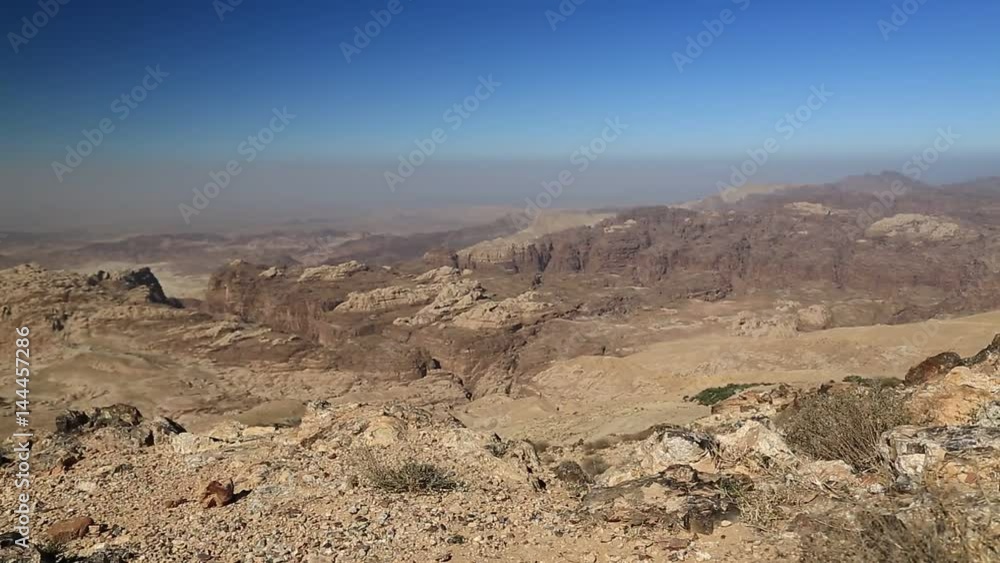 Beautiful view of Wadi Sabra desert in Hashemite Kingdom of Jordan. Amazing scenery of stony desert in Jordan, camera lens with polarisation filter Beautiful view of Wadi Sabra desert in Hashemite Kingdom of Jordan. Amazing scenery of stony desert in Jordan, camera lens with polarisation filter