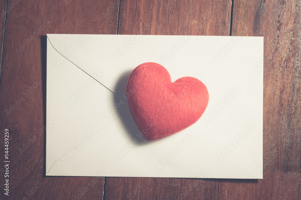 Red heart on white paper envelope. Red heart on white paper envelope.