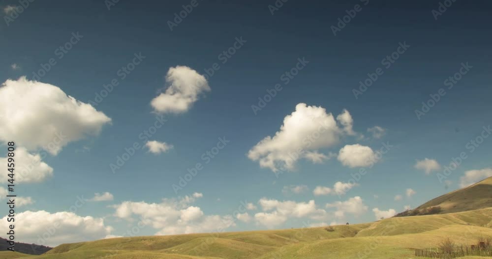 Cloudy sky above the hills with yellow grass Cloudy sky above the hills with yellow grass