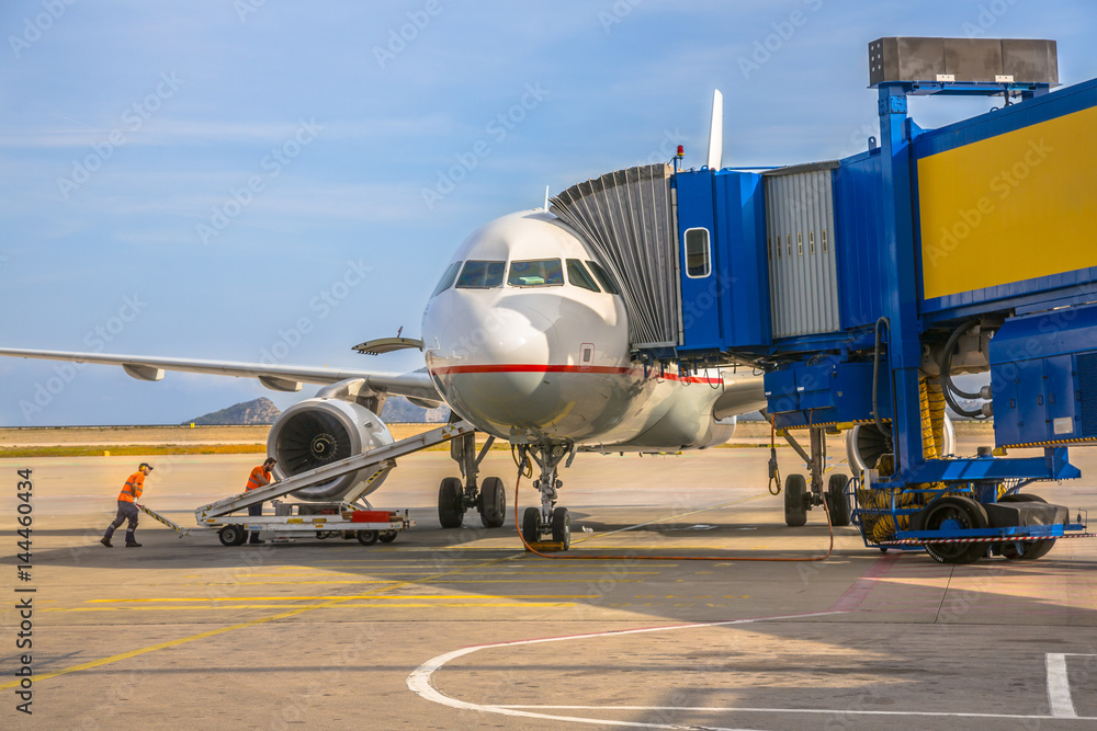 Passenger jet airplane at airport gate